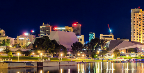 Adelaide Australia Adelaide city skyline at dusk viewed across Torrens river from King William bridge.