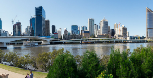Brisbane skyline Brisbane River the Victoria Bridge and the Riverside Expressway seen from the South Bank.